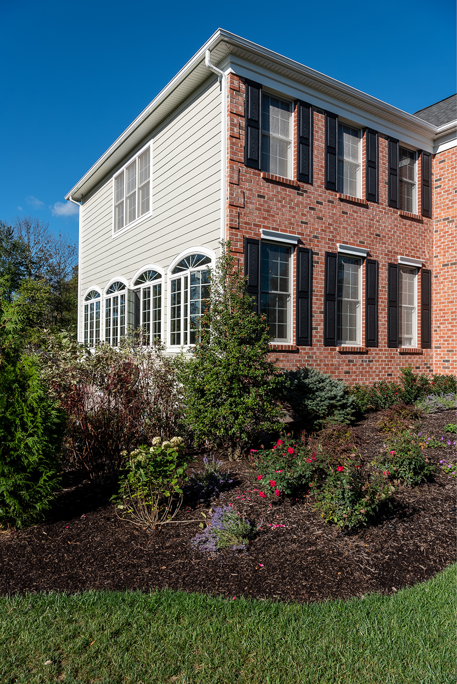 Clay's vinyl siding is great accent to the classic brick look